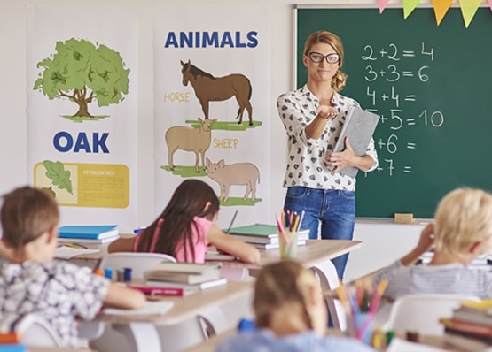 Children reading and learning English Phonics